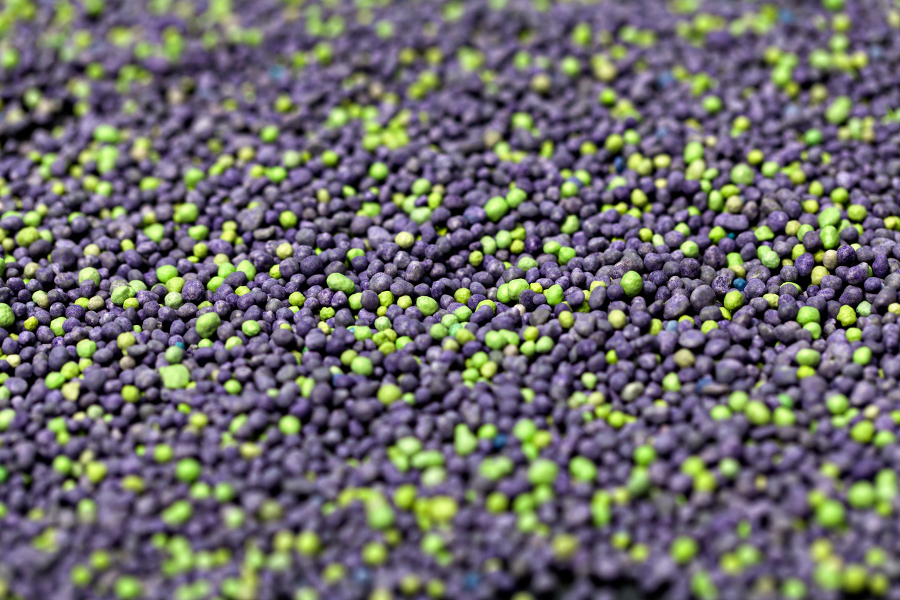 A colorful expanse of slow release fertiliser pellets with a shallow DOF, leaving a large are of defocussed pellets for placement of Copy. Canon Eos 5d mk 2.